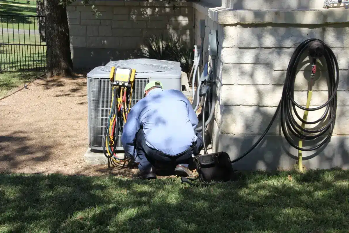 Worker ensuring ac unit is working
