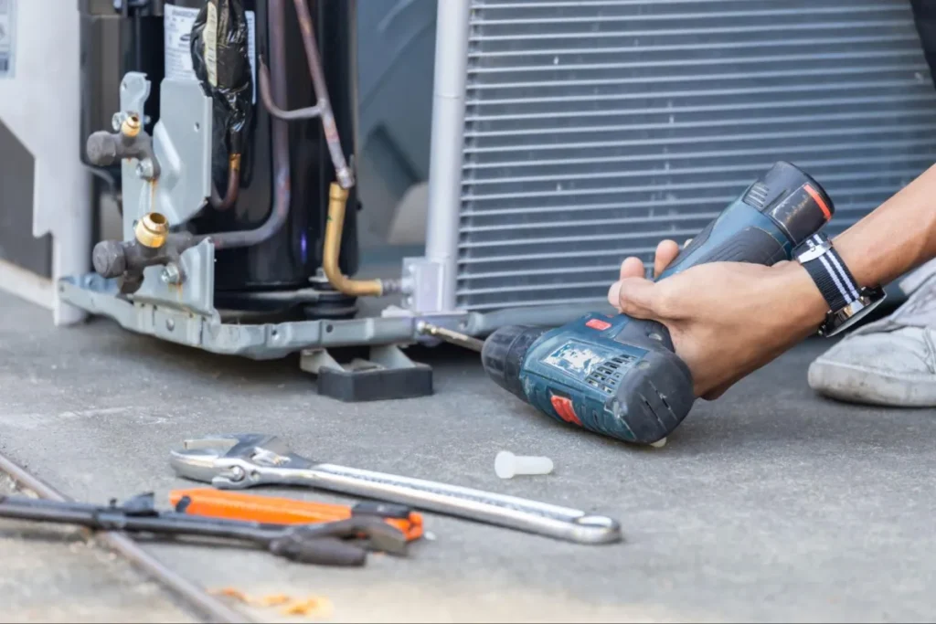 Why Your AC Won't Turn On and What to Do About It 2 Technician repairing outdoor AC unit